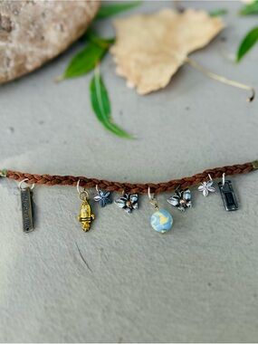 Braided Brown Leather Charm Bracelet with Blue Globe and Floral Charms